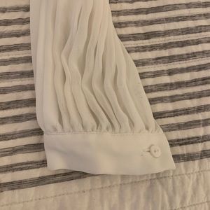 White ruffled blouse